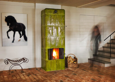 Free-standing, green tiled stove