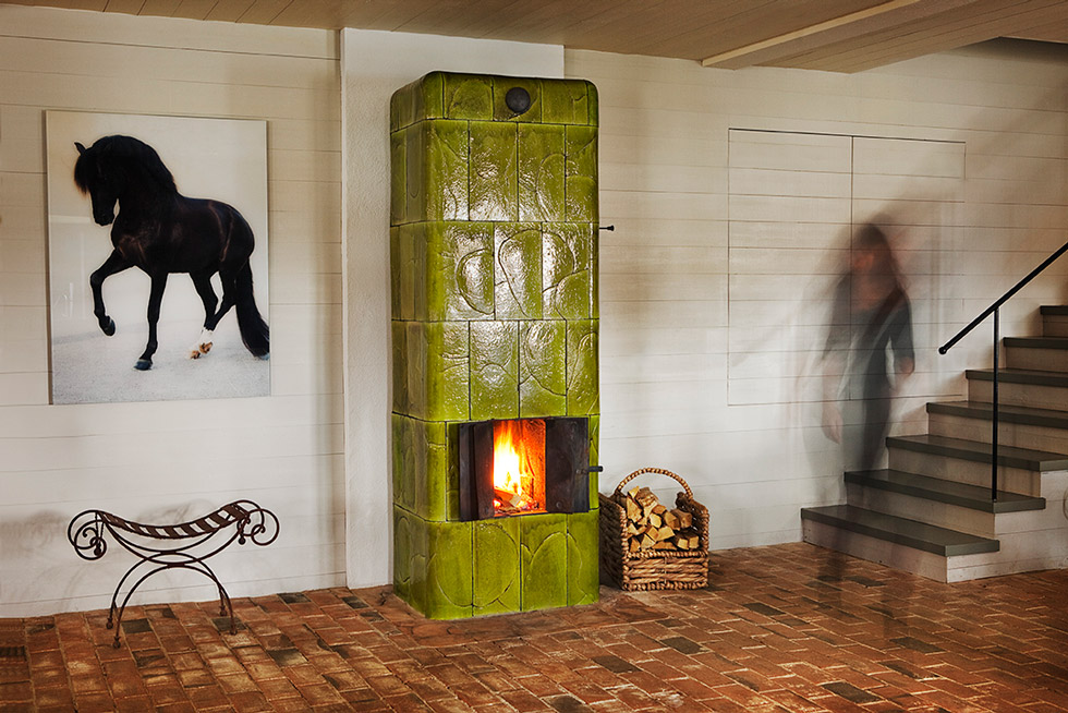 Free-standing, green tiled stove