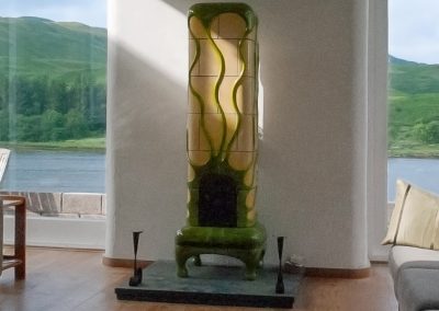 Naples yellow tiled stove, with green looping ornaments (Scotland)