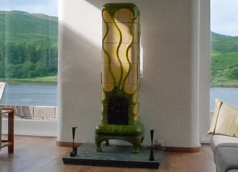 Naples yellow tiled stove, with green looping ornaments (Scotland)