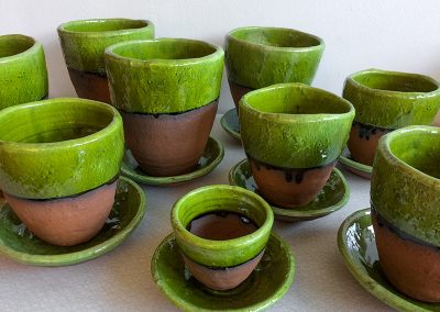 Green-glazed rough pots with plates