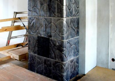 Free-standing gray tiled stove